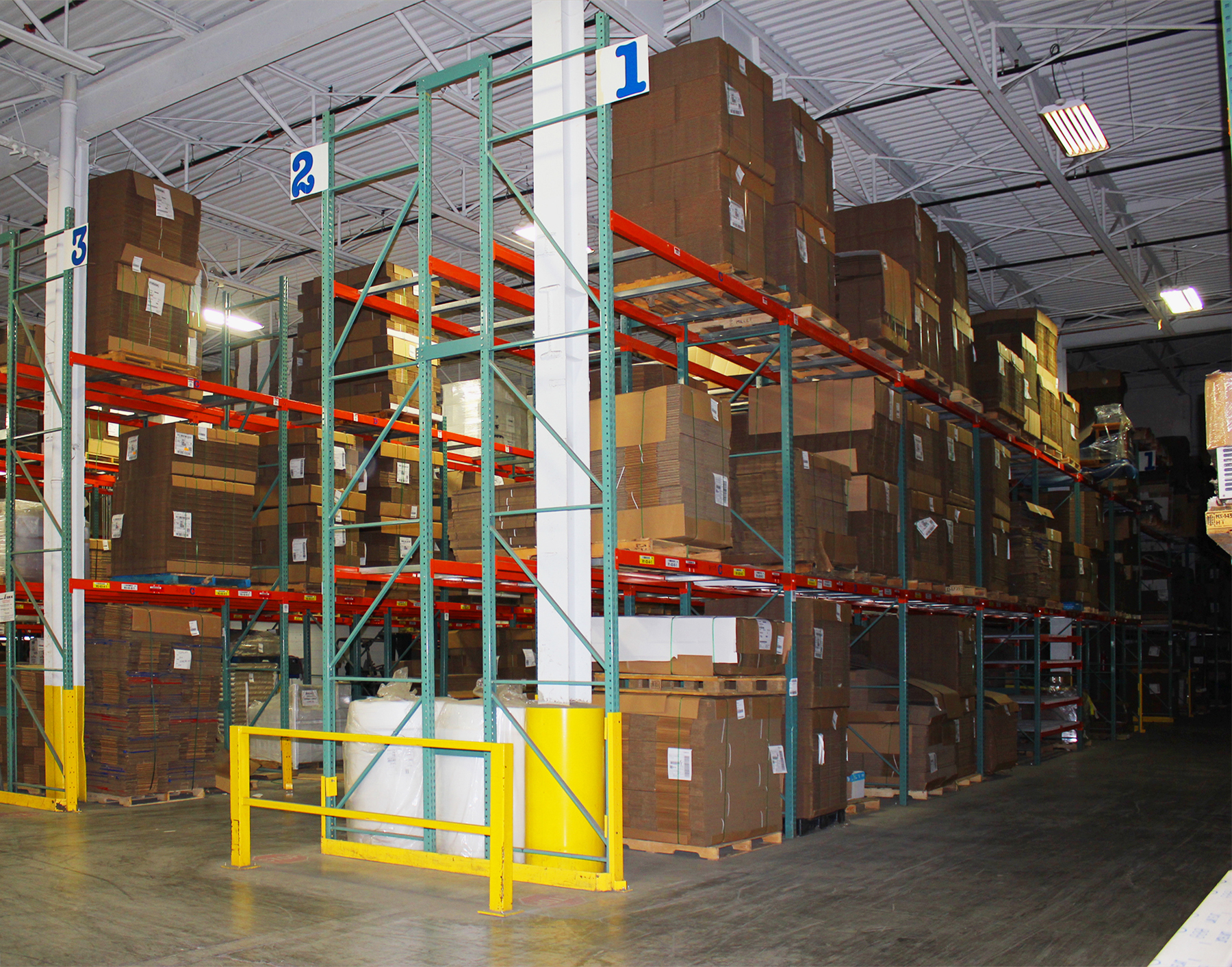 Industrial building 7500 Cote de Liesse for sale with 75,781 SF warehouse and neat racking.