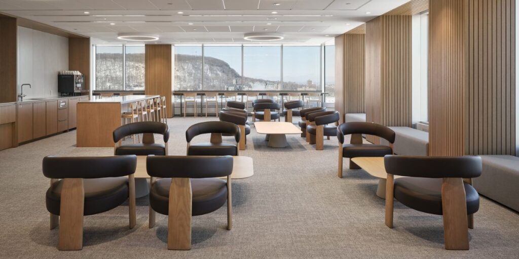 Optimize Your Existing Office Footprint Before You Expand Your Lease 2 Employees collaborating in a flexible workplace designed to adapt to changing team and space needs over time